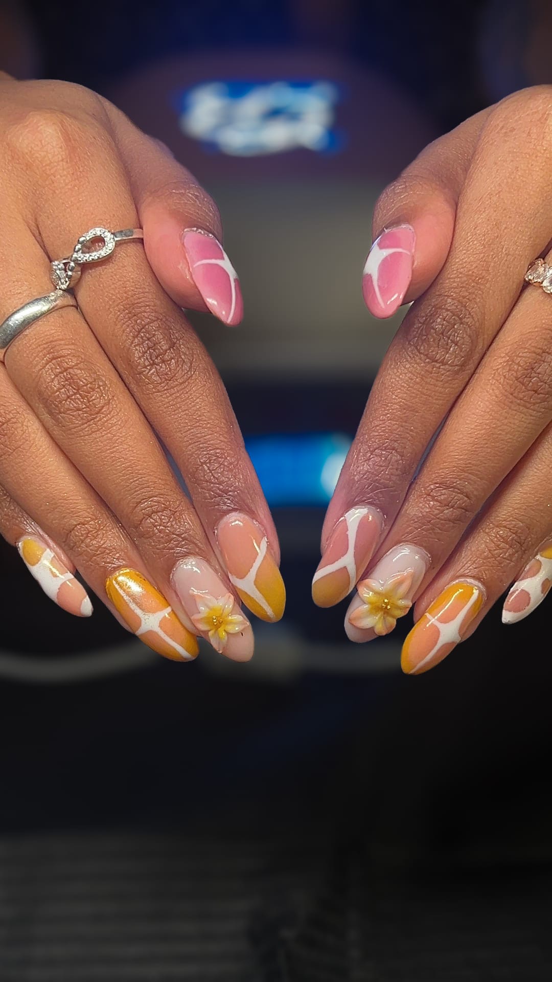 Orange and white floral nail design